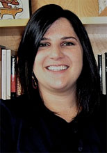 Heidi in Full Black Outfit on a Book Shelf Background